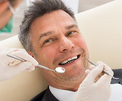 How Should My Home Care Routine Change if I Get Dentures Image